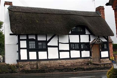 tudor house with metal roof|tudor house thatched roof.